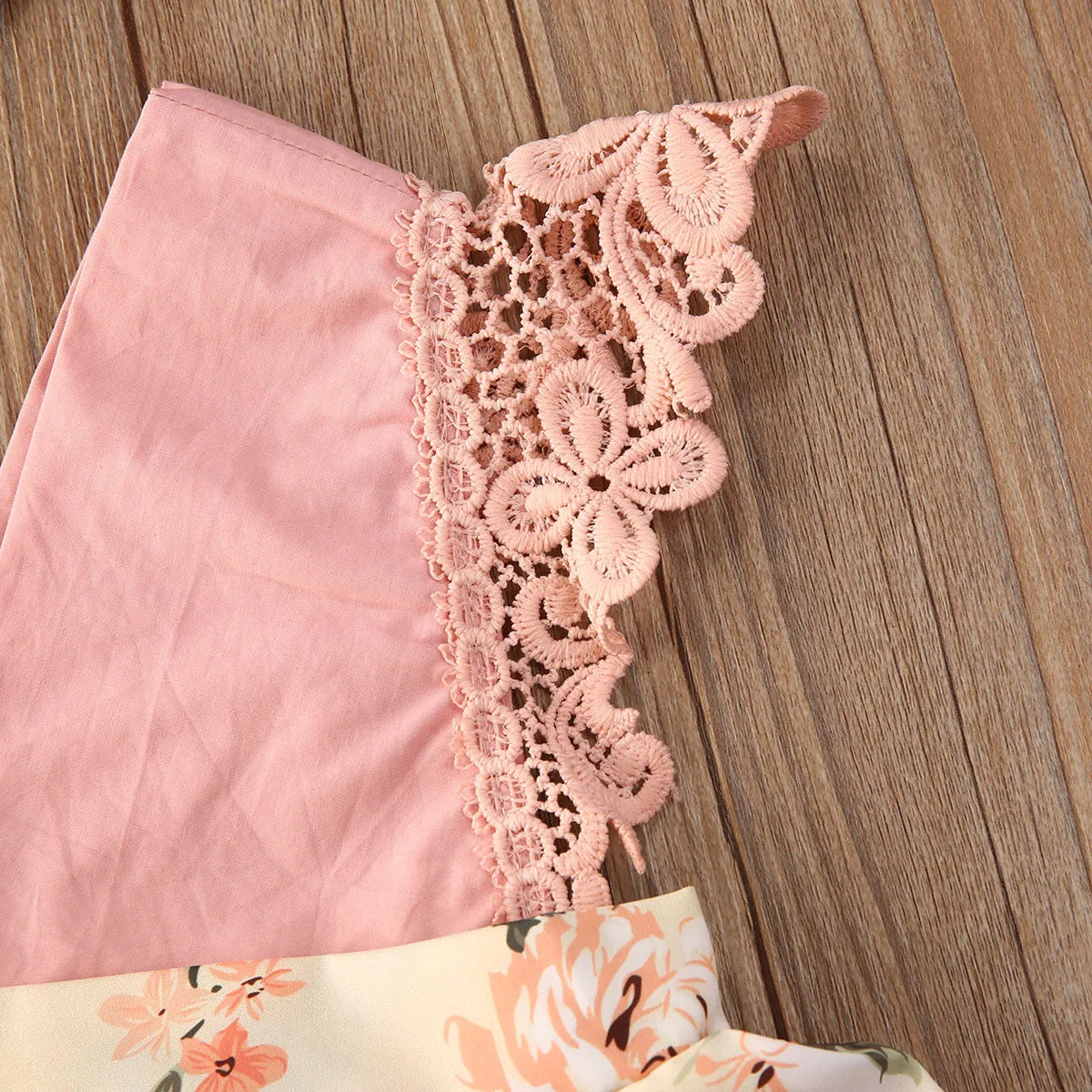 Baby girl pink floral lace V neck sleeveless jumpsuit with matching headband on white background