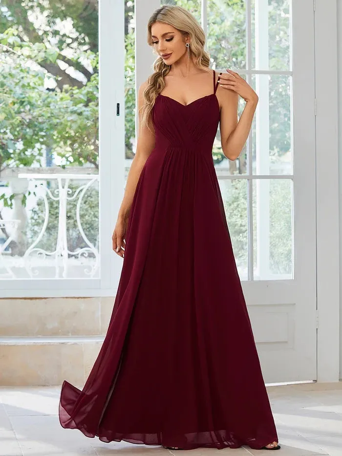 Women's sleeveless A-line long dress with pleated skirt detail in solid colour
