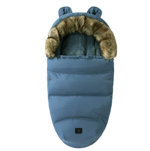 Baby warm cocoon style sleeping bag on a neutral background demonstrating solid colour design with zip closure