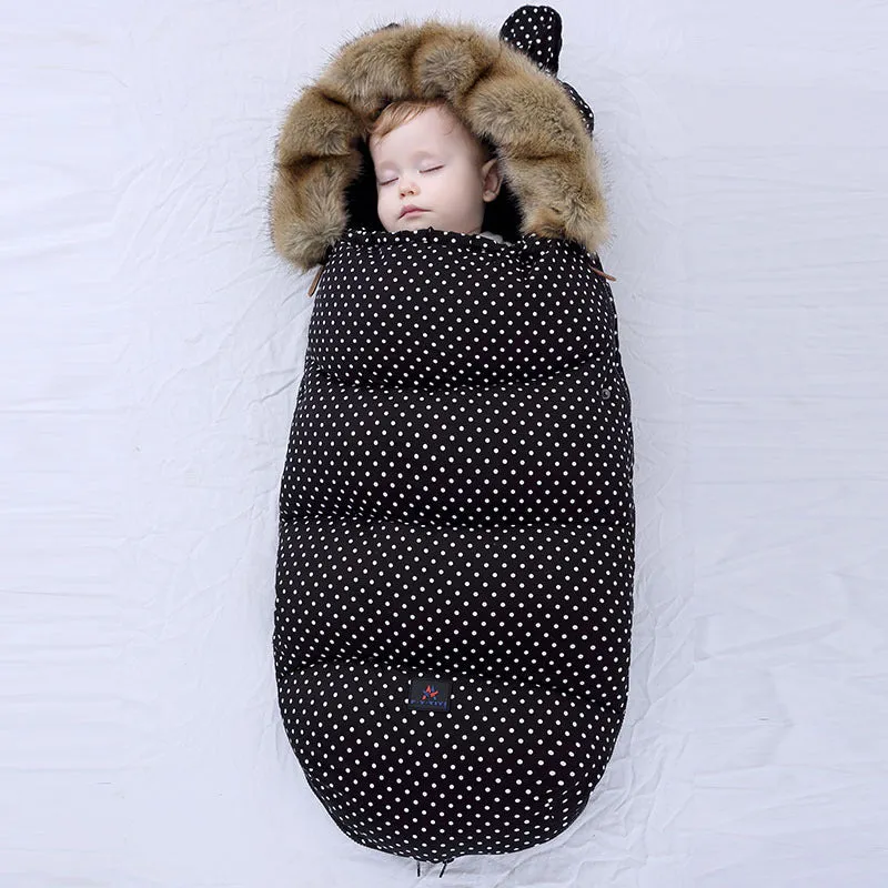 Baby warm cocoon style sleeping bag on a neutral background demonstrating solid colour design with zip closure
