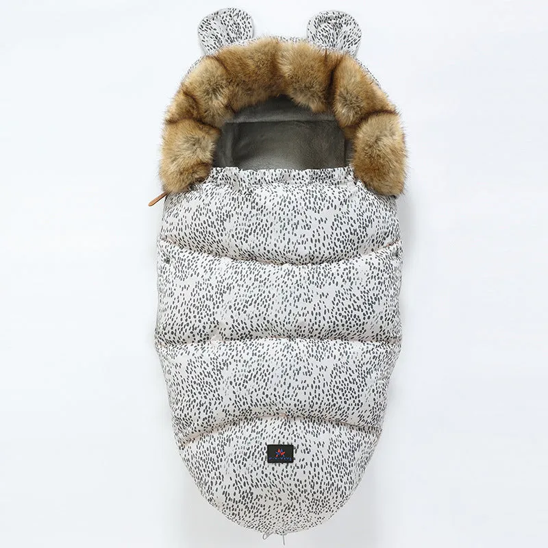Baby warm cocoon style sleeping bag on a neutral background demonstrating solid colour design with zip closure