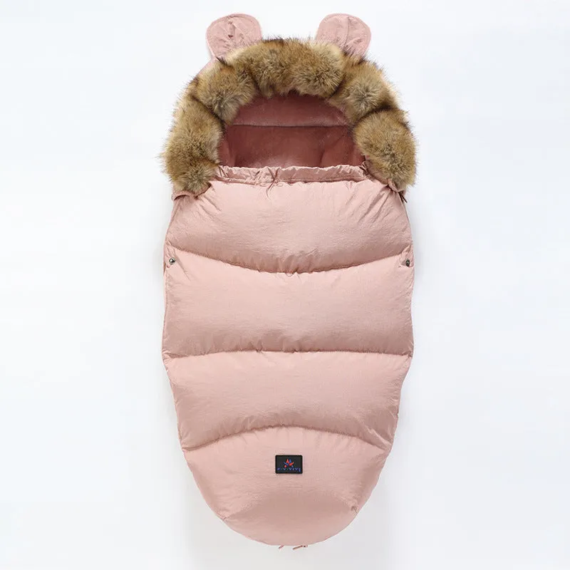 Baby warm cocoon style sleeping bag on a neutral background demonstrating solid colour design with zip closure
