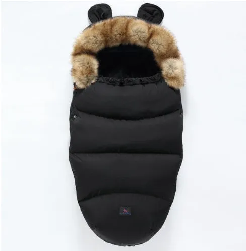 Baby warm cocoon style sleeping bag on a neutral background demonstrating solid colour design with zip closure