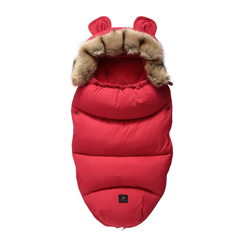 Baby warm cocoon style sleeping bag on a neutral background demonstrating solid colour design with zip closure