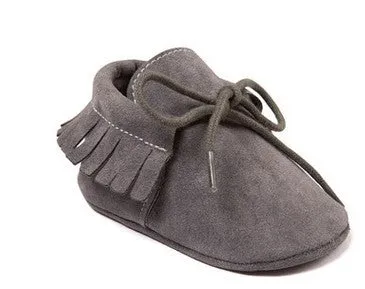 Pair of baby shoes with tassel and polychromatic sanding finish in a colourful pattern on soft sole