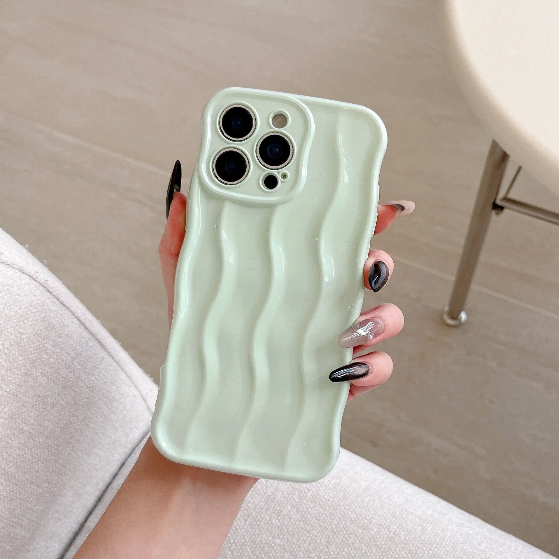 Electroplated 3D wave stripe protective case for iPhone 17 Pro Max in silver finish.
