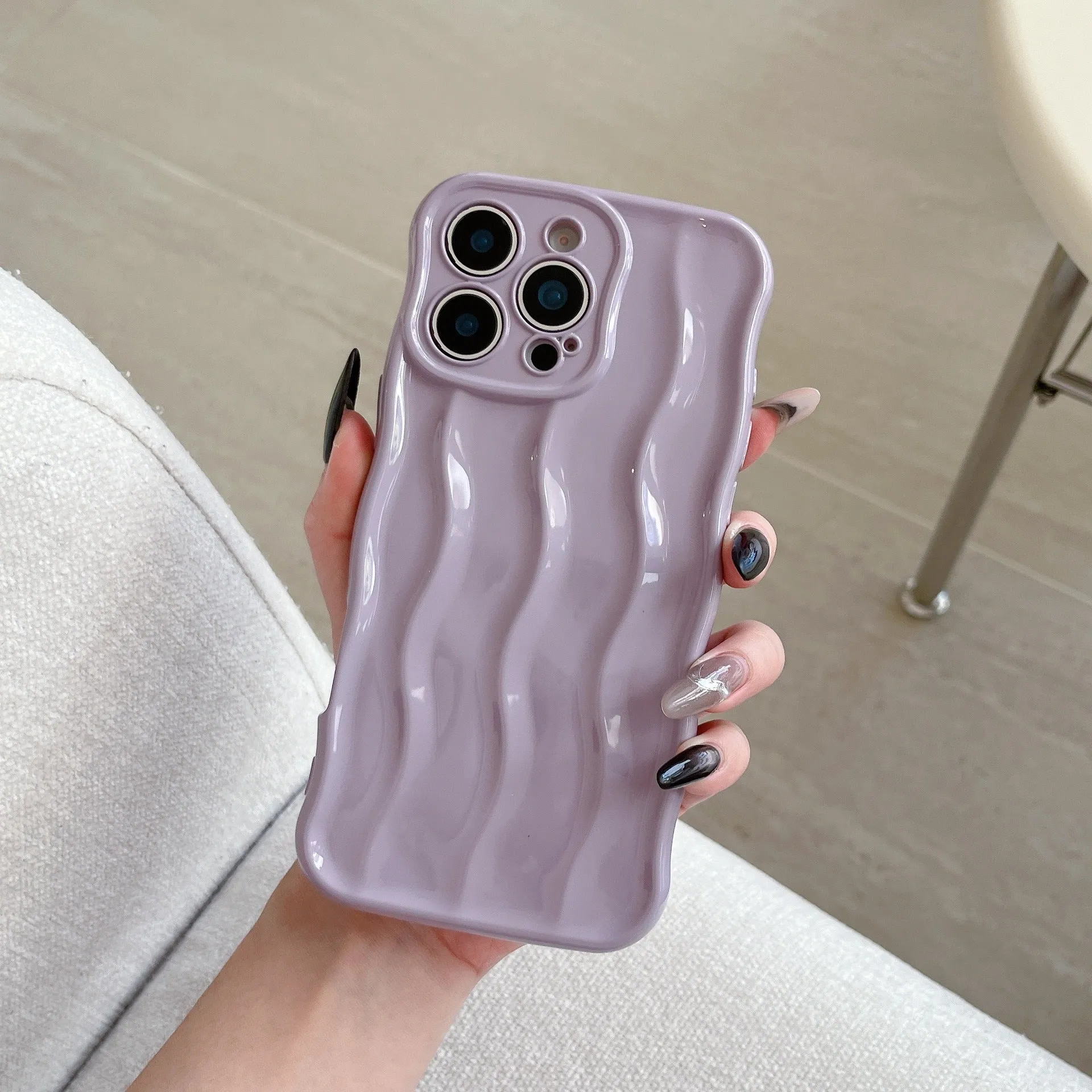 Electroplated 3D wave stripe protective case for iPhone 17 Pro Max in silver finish.