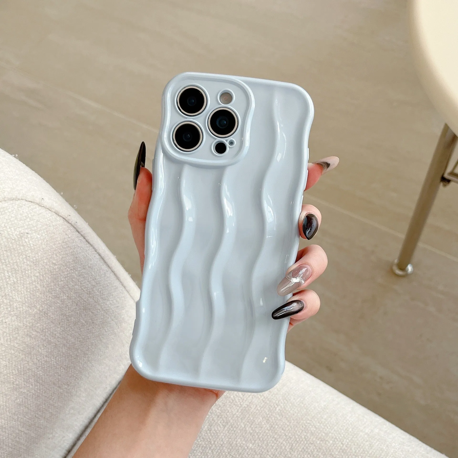 Electroplated 3D wave stripe protective case for iPhone 17 Pro Max in silver finish.