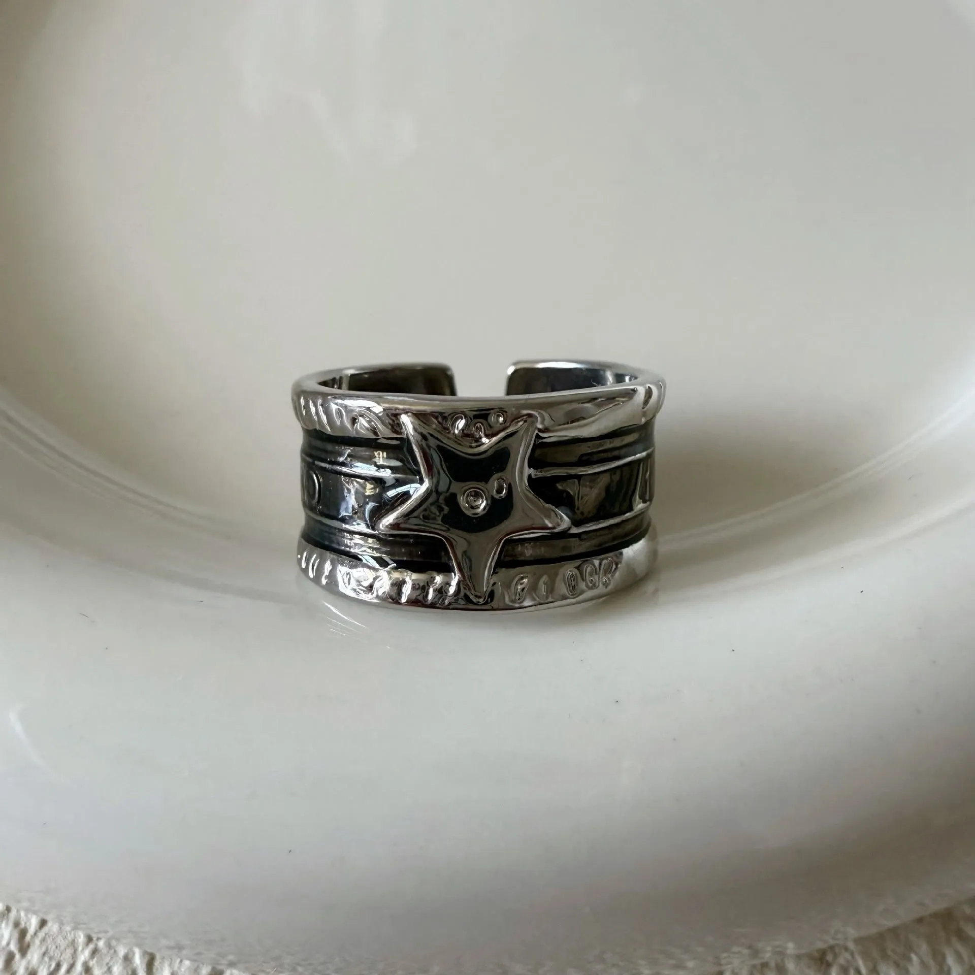 XINGX geometric oil drop ring with adjustable band and distressed finish in multiple colours.