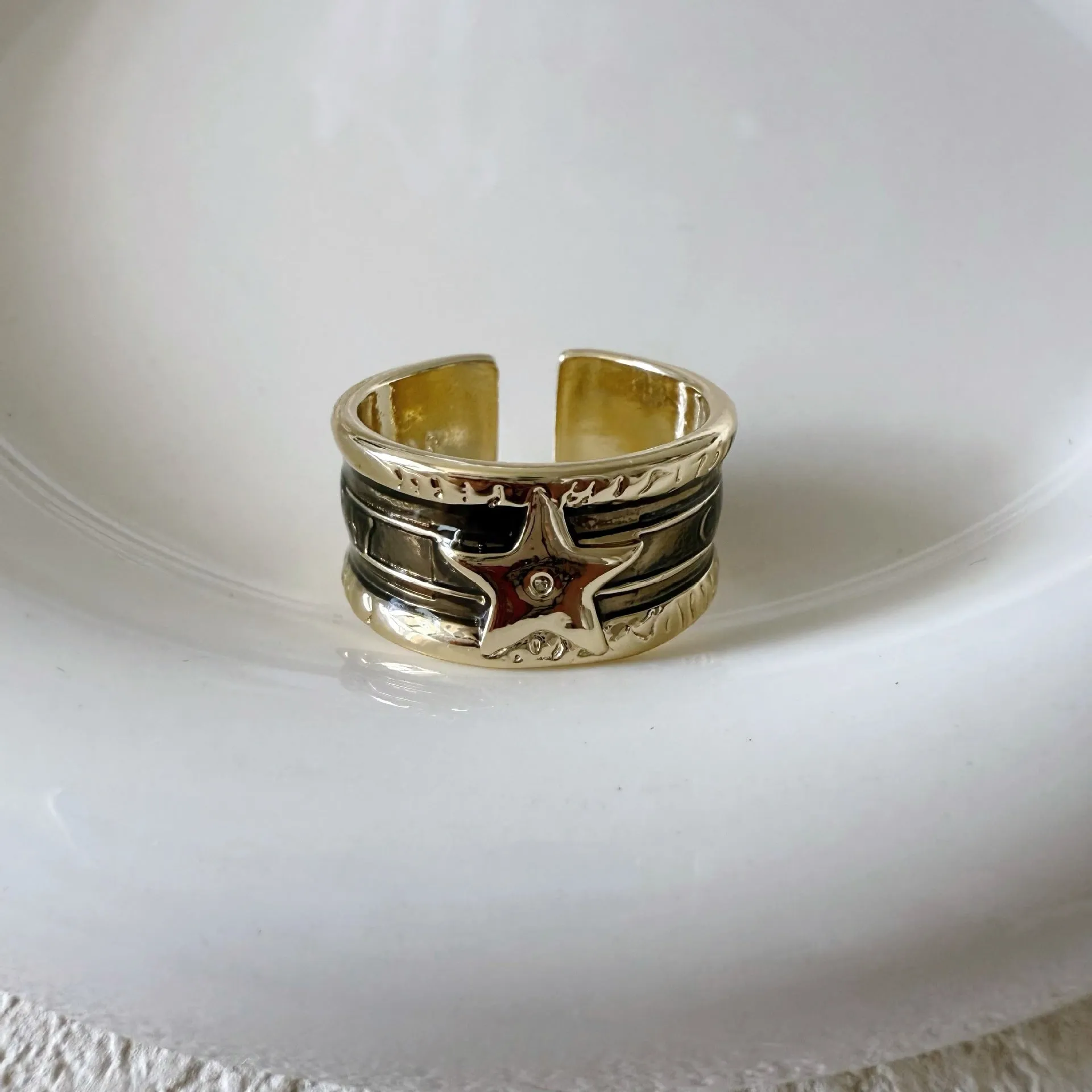 XINGX geometric oil drop ring with adjustable band and distressed finish in multiple colours.