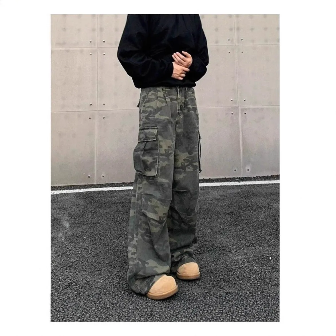 American Vintage camouflage cargo pants with multiple pockets and a washed, crumpled fabric texture.