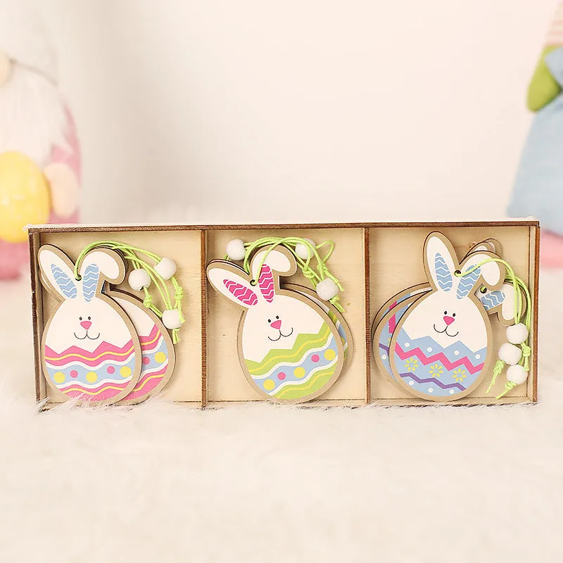 Set of 9 painted wooden Easter pendants with bunny, egg, and owl designs on a light background