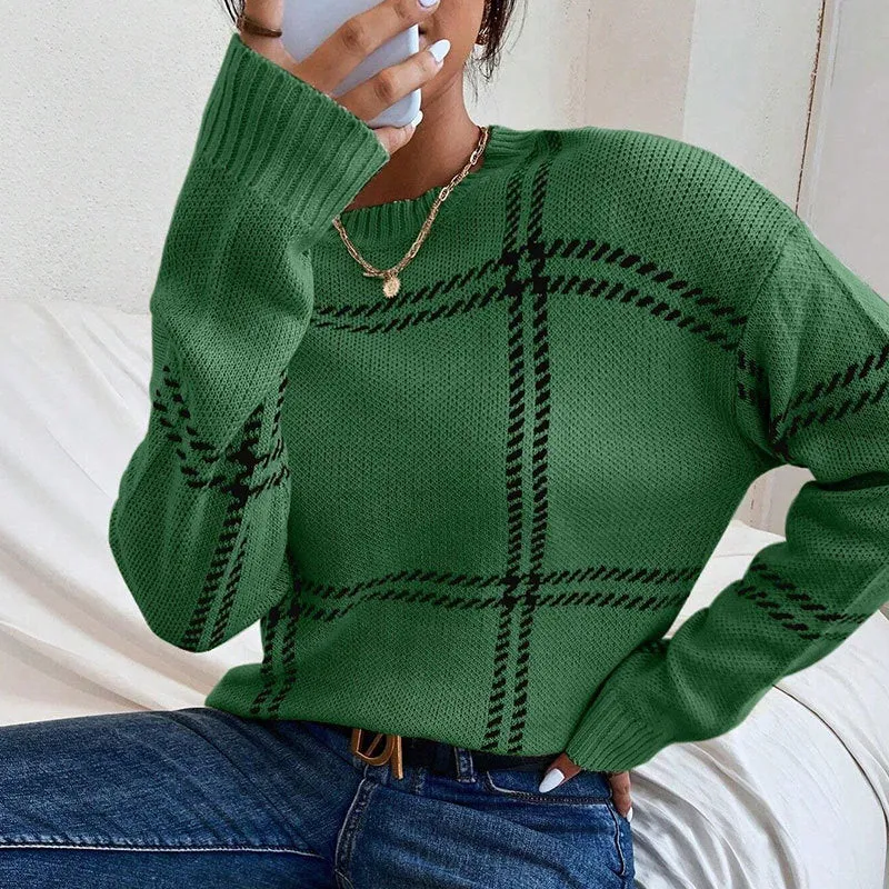 Women's loose-fit acrylic pullover sweater with a red, green, and beige plaid colour-block pattern.