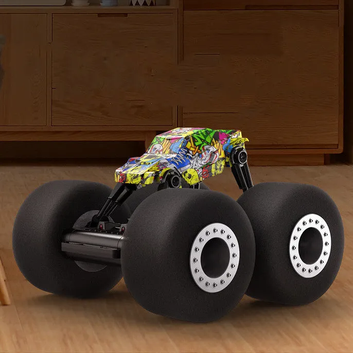 Remote control stunt truck with sponge tires and cool lights on a wooden floor
