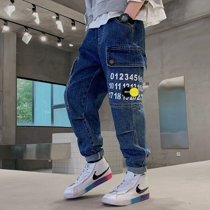 Boys printed blue cotton mid-waist girdled jeans with rubber band belt on white background