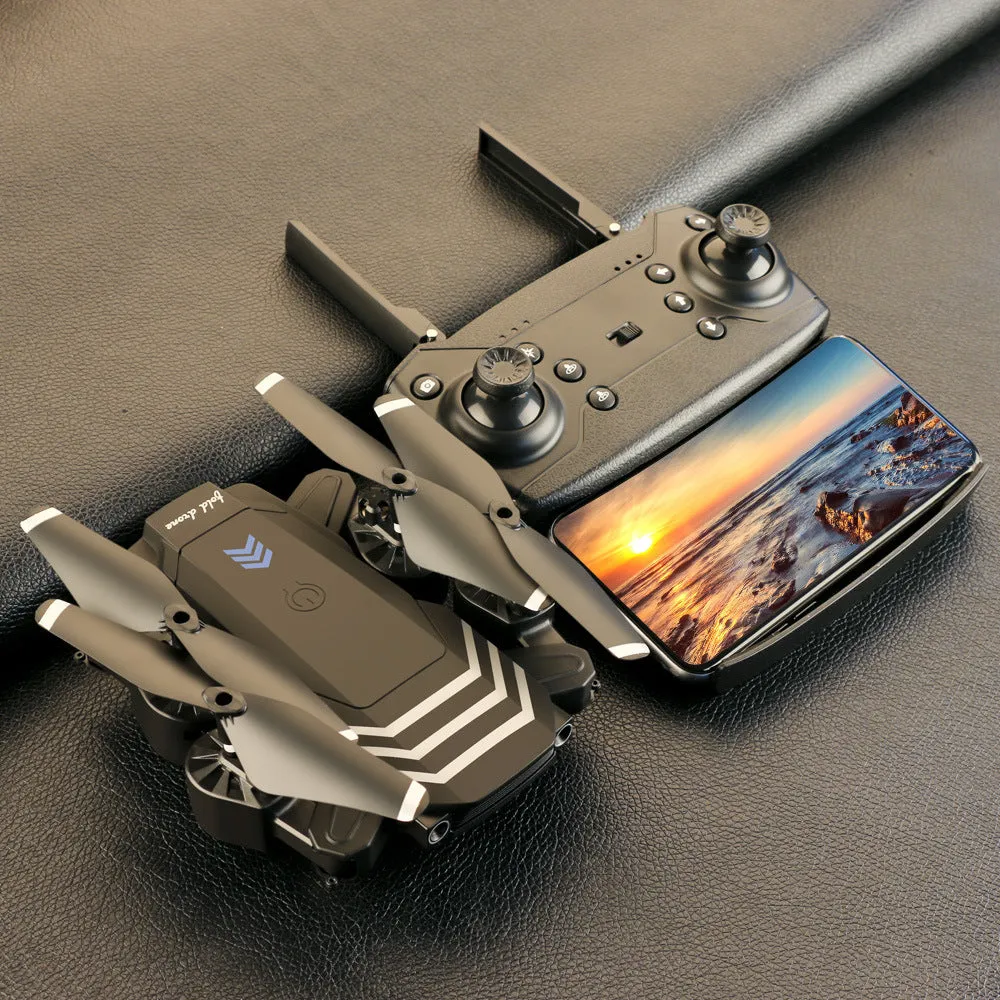 Remote control four-axis quadcopter drone with foldable arms and 4K camera, black, on a flat surface