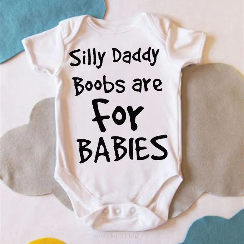 White triangle climbing baby bodysuit with black text reading 'Silly Daddy Boobs Are For Babies'