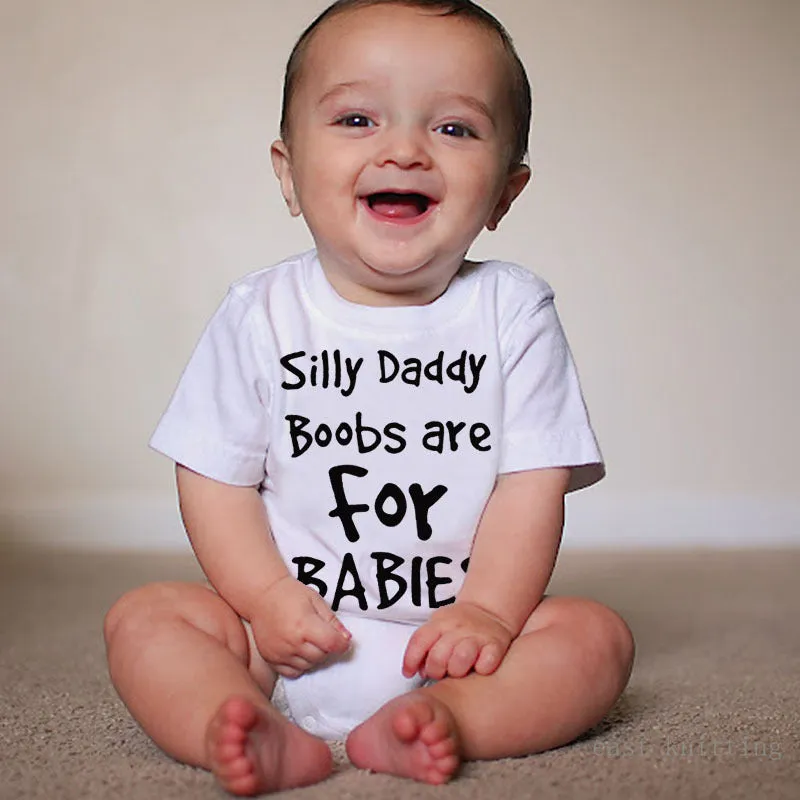 White triangle climbing baby bodysuit with black text reading 'Silly Daddy Boobs Are For Babies'