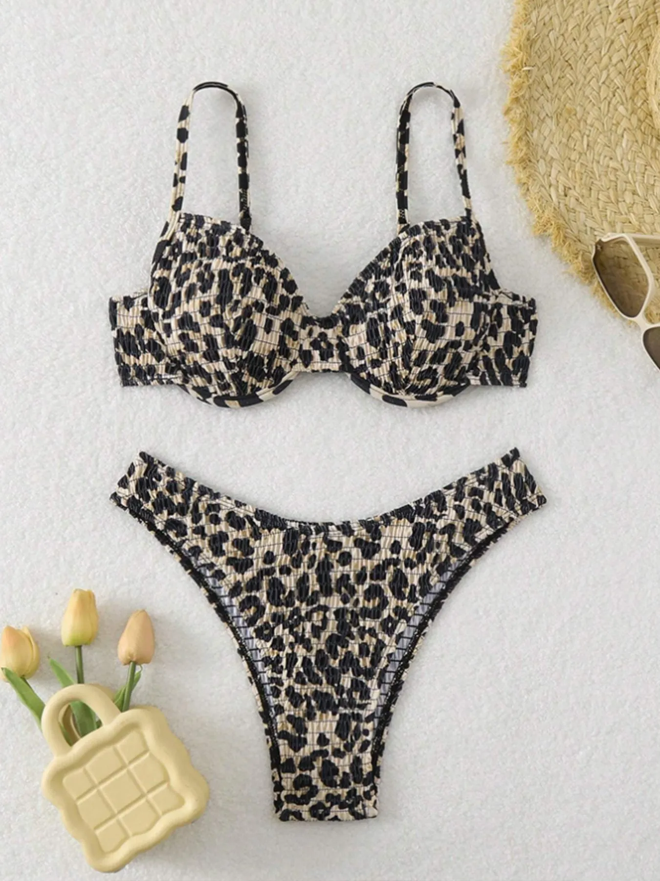 Women's leopard point bikini swimsuit in a backless brief style, shown in brown mixed colour.