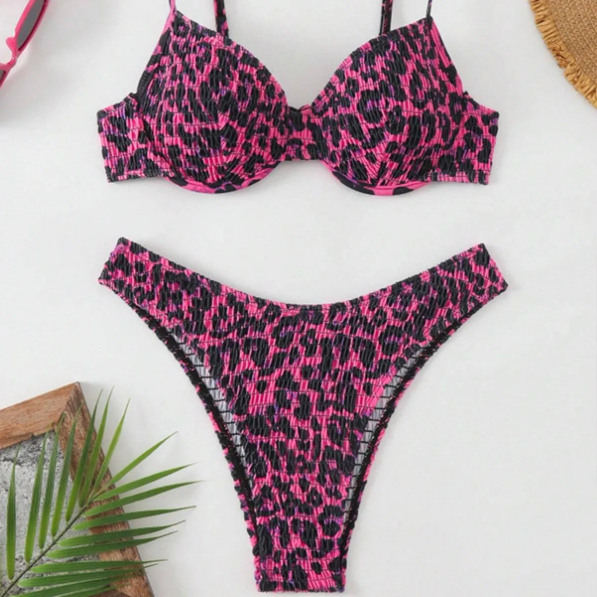 Women's leopard point bikini swimsuit in a backless brief style, shown in brown mixed colour.