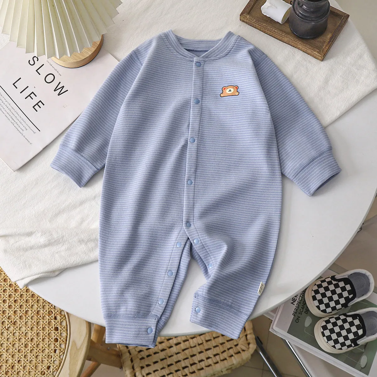 Baby Dralon striped jumpsuit romper in bean green with long sleeves and hide hook closure on white background