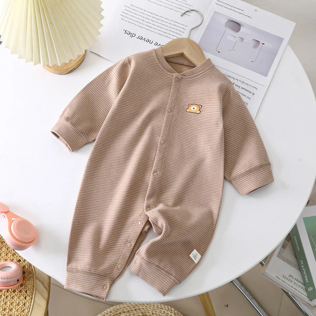 Baby Dralon striped jumpsuit romper in bean green with long sleeves and hide hook closure on white background