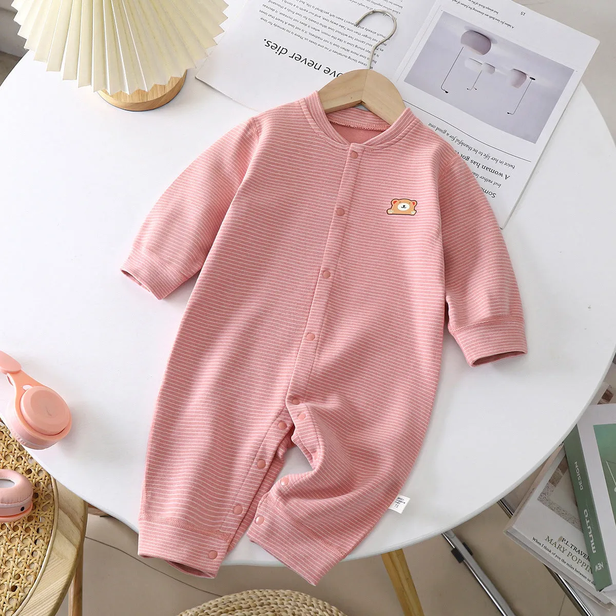 Baby Dralon striped jumpsuit romper in bean green with long sleeves and hide hook closure on white background