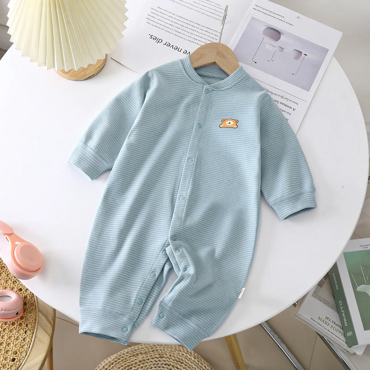 Baby Dralon striped jumpsuit romper in bean green with long sleeves and hide hook closure on white background