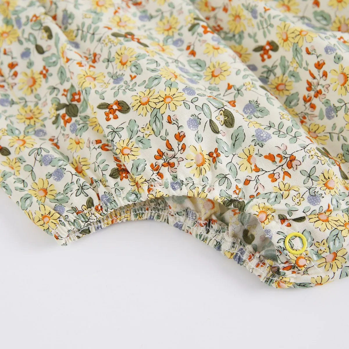 Yellow cotton floral baby romper with doll collar, triangle jumpsuit style for girls 0-6 months to 2-3 years