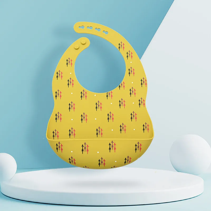 Silicone baby eating bib with adjustable neck and deep catch pocket on a child