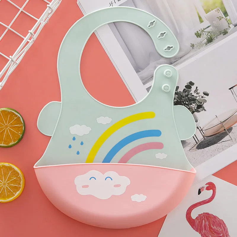 Silicone baby eating bib with adjustable neck and deep catch pocket on a child