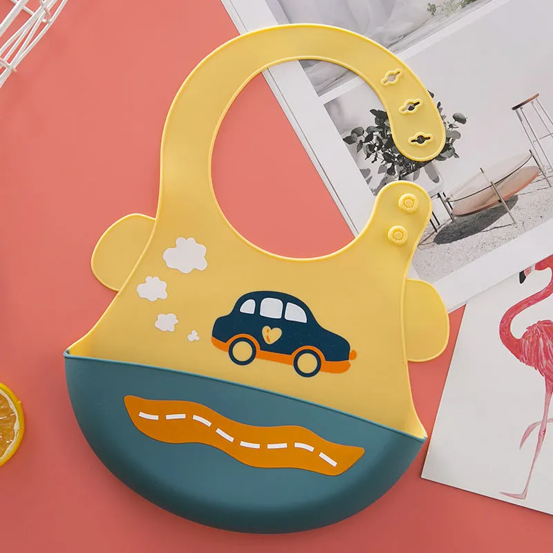 Silicone baby eating bib with adjustable neck and deep catch pocket on a child