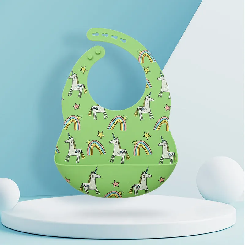 Silicone baby eating bib with adjustable neck and deep catch pocket on a child