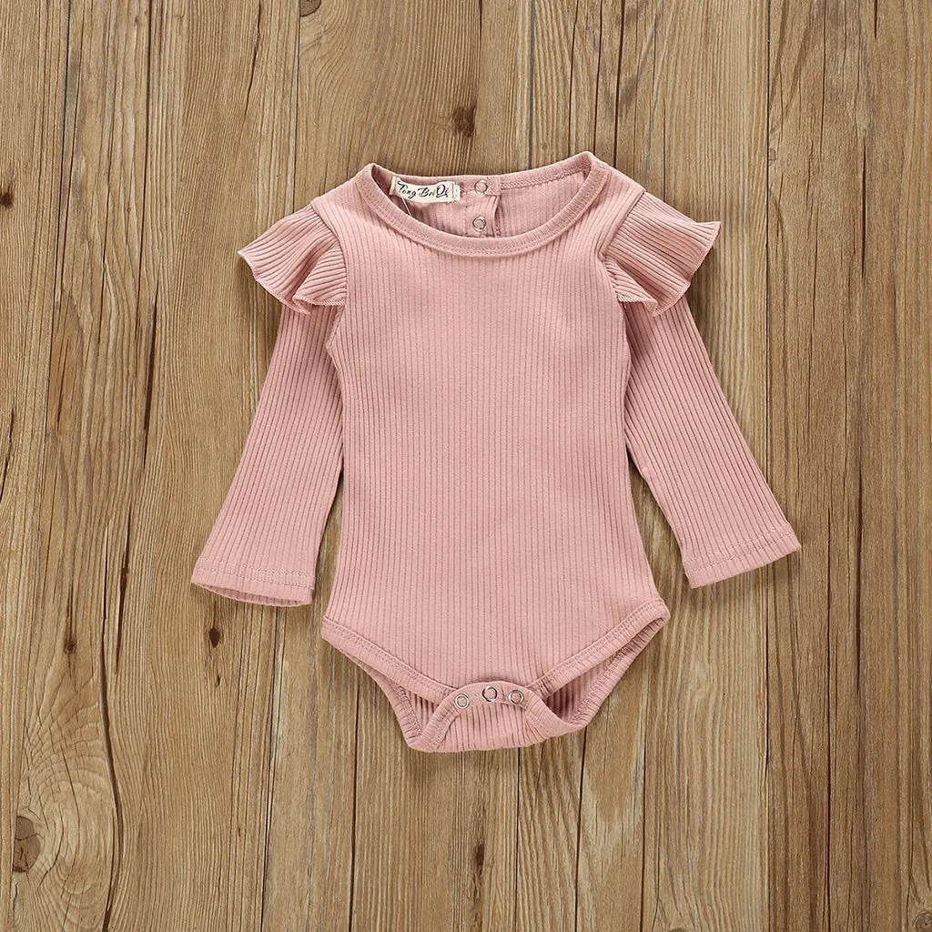 Women's pink cotton long sleeve top with size chart showing bust, length, waist measurements in centimetres