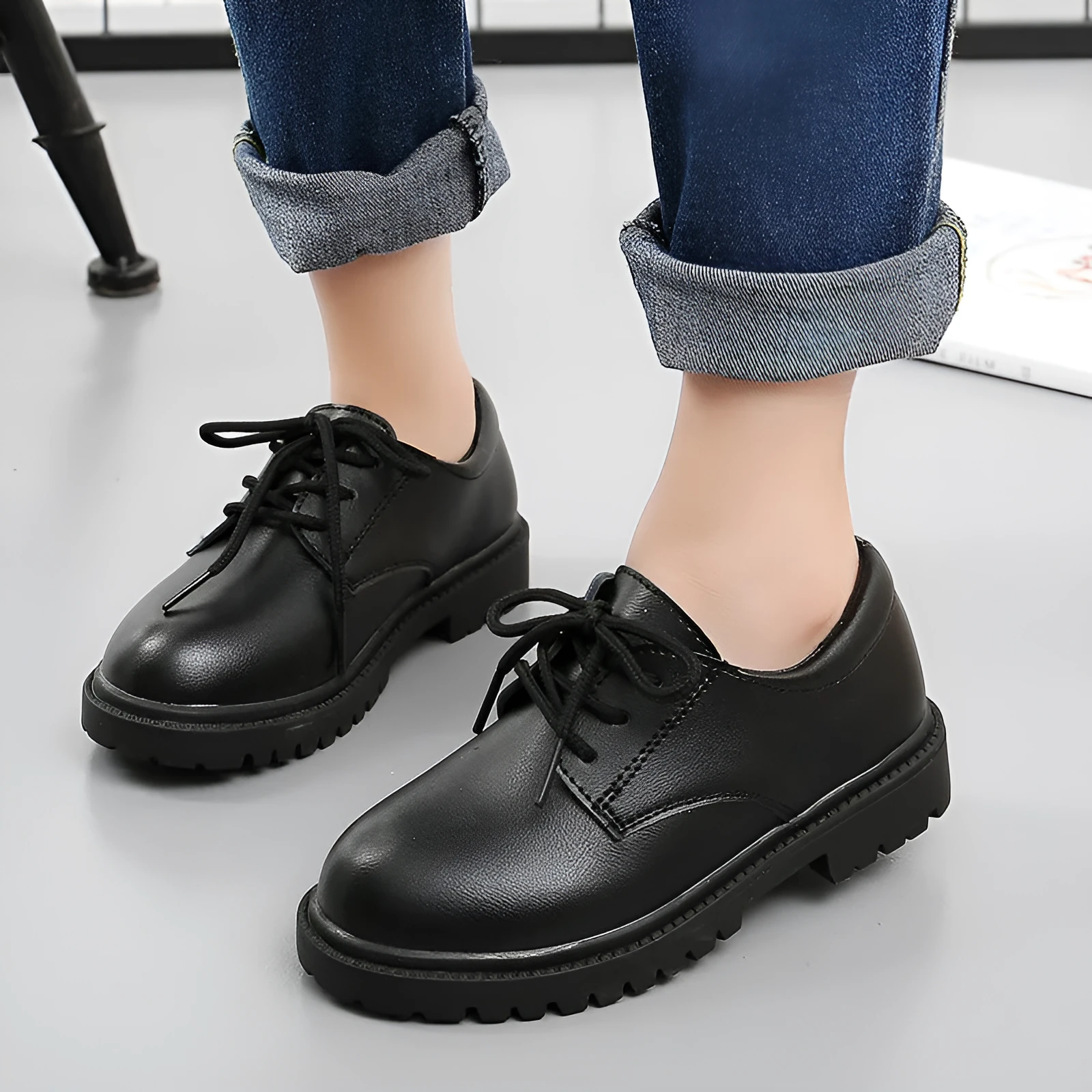 School designated black dance shoes with rubber sole and low top design for children