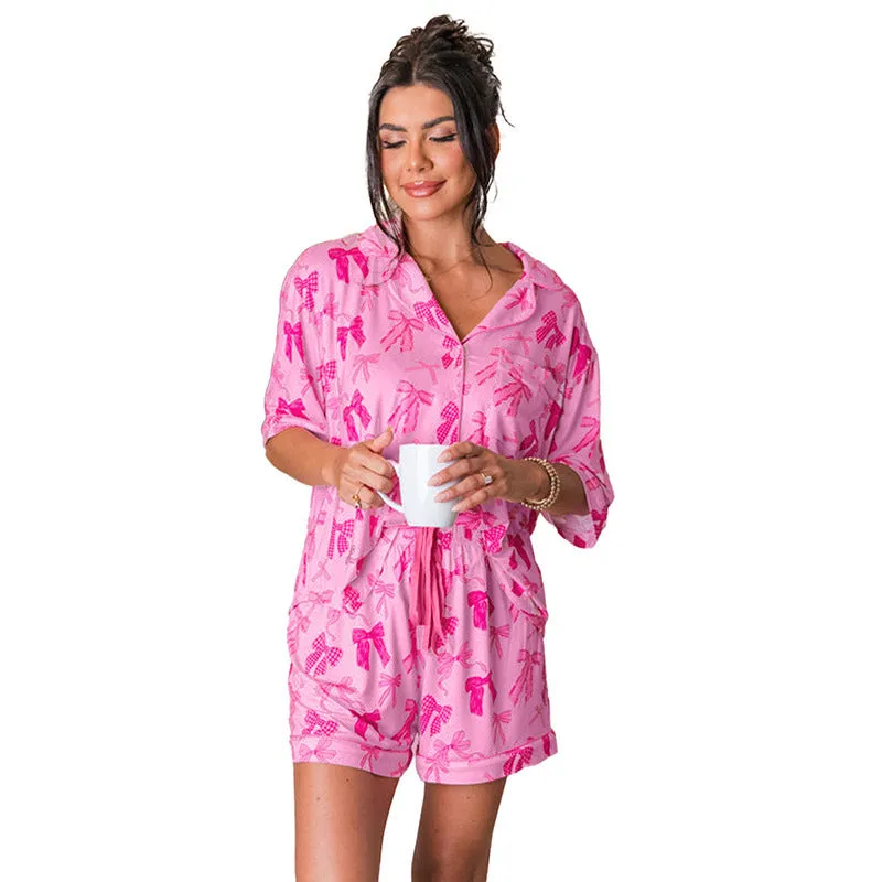 Women's pink bow print two-piece pajama set in lightweight polyester fabric