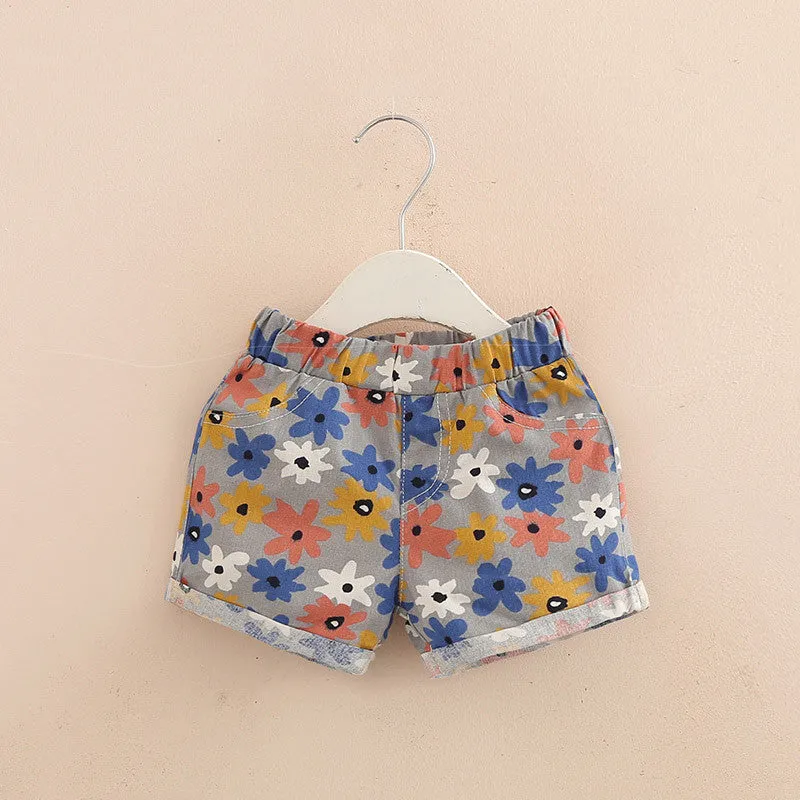 Girls casual elastic waist summer shorts in sky blue striped yellow flower pattern, size 120cm