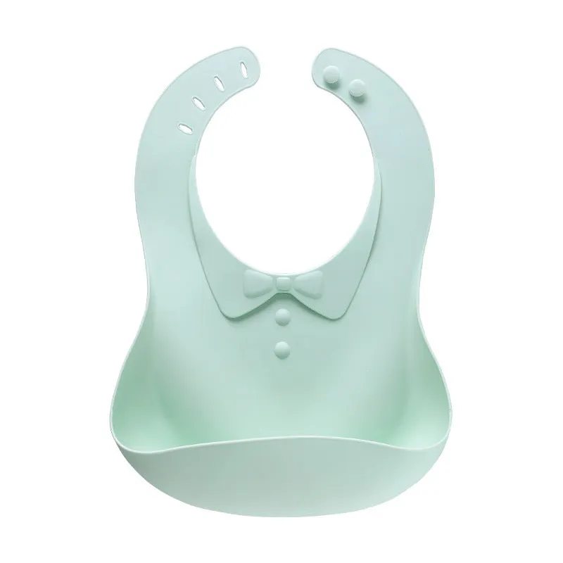 Waterproof soft plastic children bib with cartoon pattern in red, green, and blue colour options