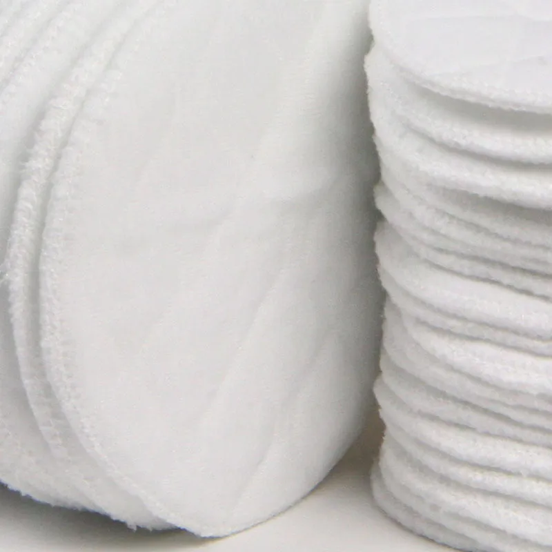 Pack of four white eco-cotton double-layer anti-galactorrhea nursing pads on a white background