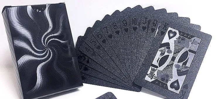 Black Diamond waterproof plastic poker cards with gold foil finish showing laser-etched diamond pattern on black background