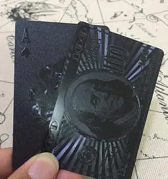 Black Diamond waterproof plastic poker cards with gold foil finish showing laser-etched diamond pattern on black background