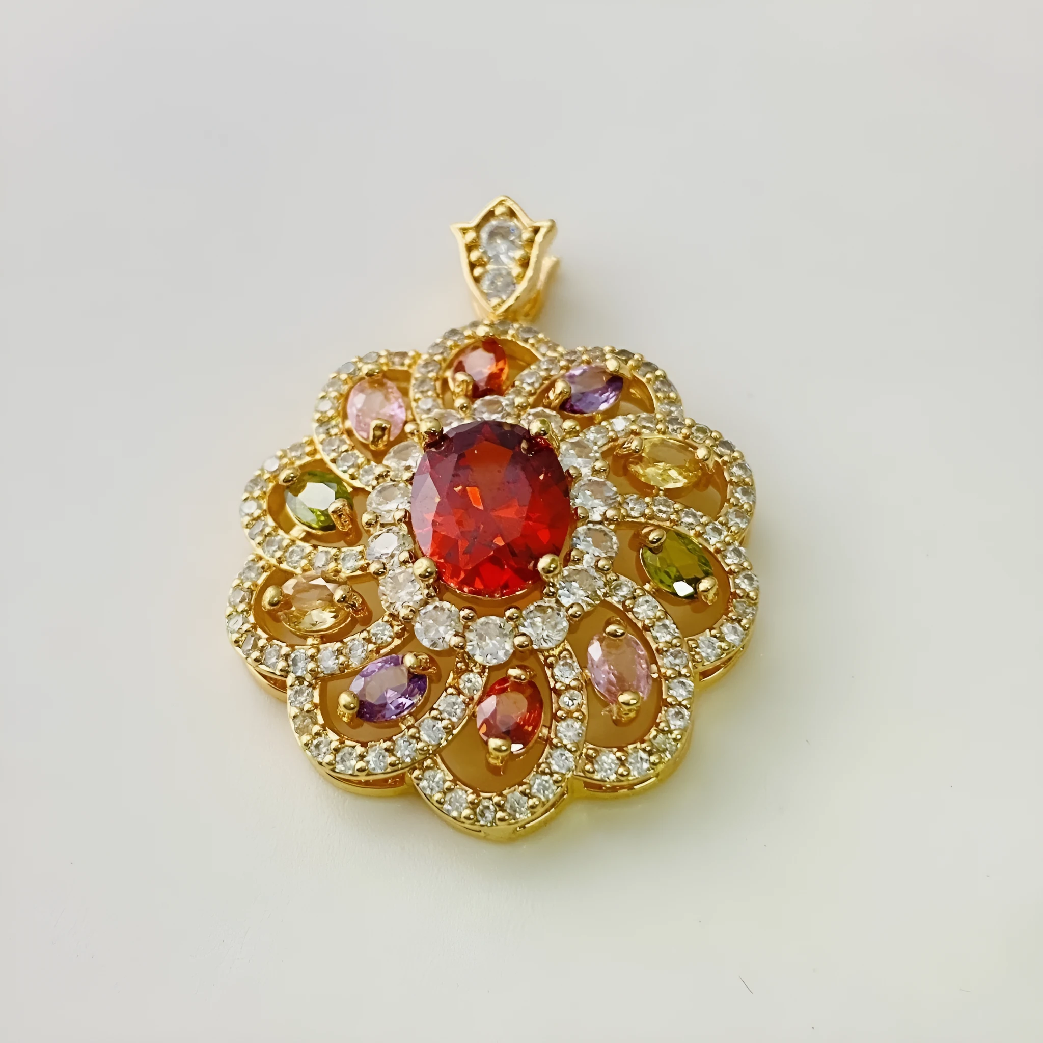 Close-up of a women's flower-shaped zircon pendant necklace in a gold electroplated finish.