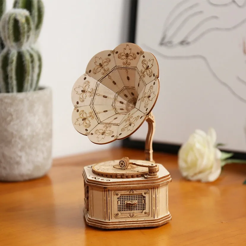 Wooden 3D puzzle model of a balloon assembled from pre-cut wood pieces on a light background