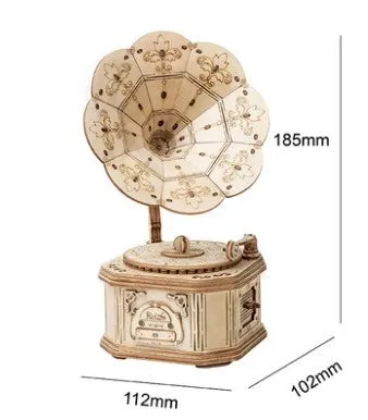 Wooden 3D puzzle model of a balloon assembled from pre-cut wood pieces on a light background