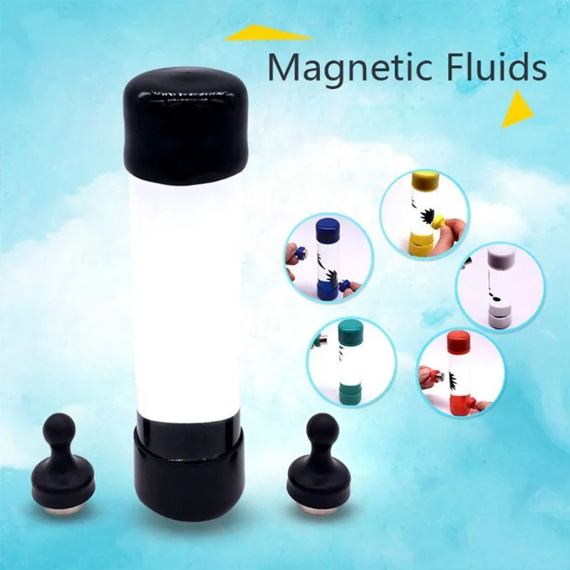 Magnetic fluid toy in a glass bottle with red ferrofluid and two black magnets on a white surface
