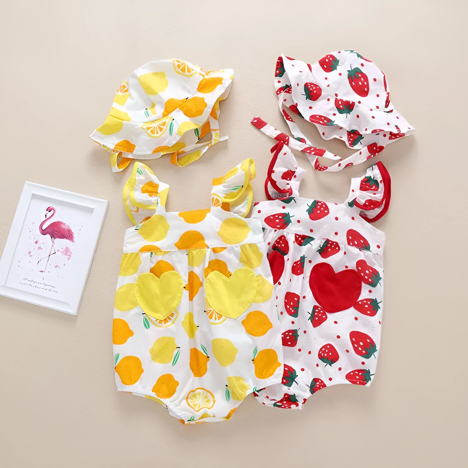Cotton summer baby romper triangle jumpsuit in yellow with removable hat on white background