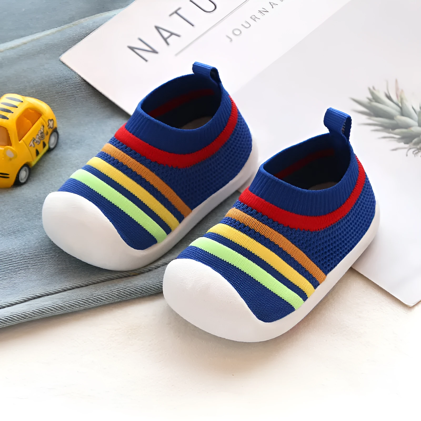 Children's flying knit sock shoes in blue with lace detailing and low-top design