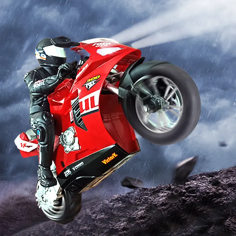 Side-tracking off-road remote control electric motorcycle toy in metallic red with rider