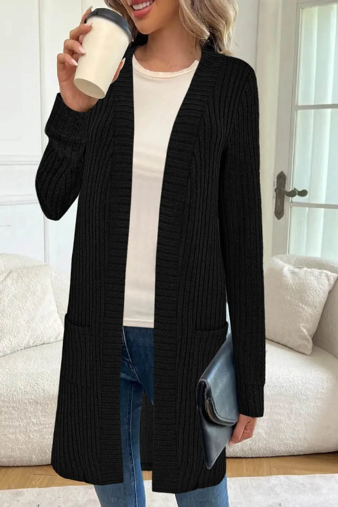 Long sleeve loose cardigan jacket in black, wine red, or grey with pockets, shown on a hanger.