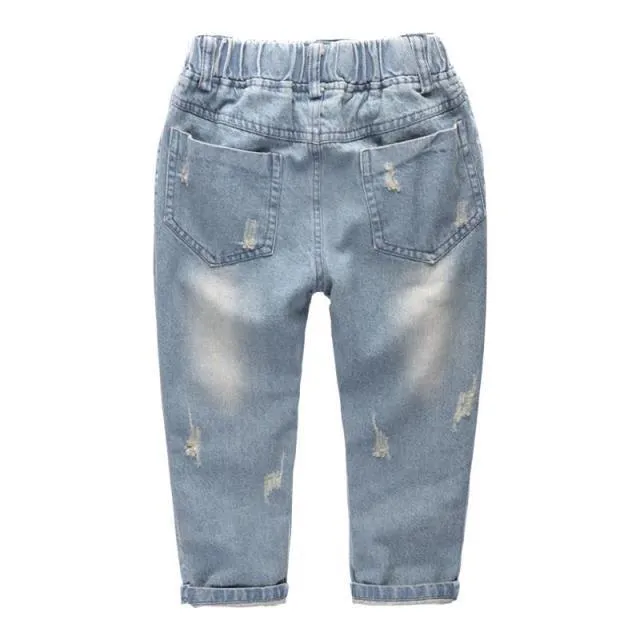 Light blue children's cotton skinny slim jeans laid flat showing slim leg and regular waist
